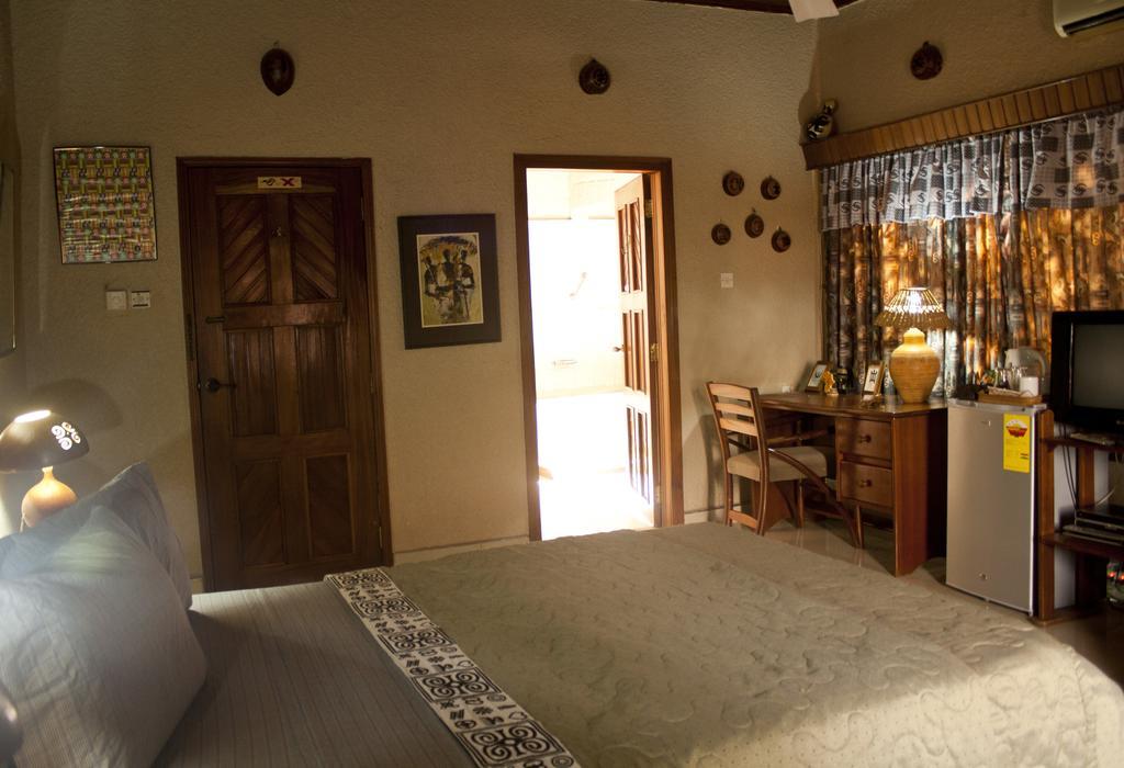Four Villages Inn Kumasi Zimmer foto